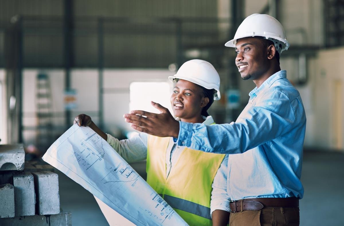 Engineers reviewing blueprints